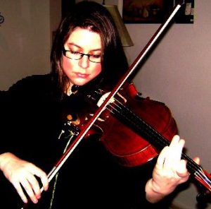 Teah Akrish playing the viola.